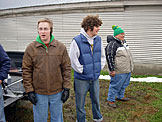 Abe, Ben, and Leo watch as Kristi takes out some aggression.
