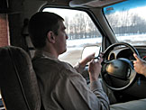 Jason Klopfenstein takes another phone call while Dan takes the wheel.  Safety first kids.